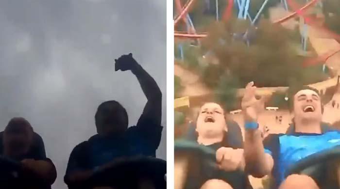 'رولرکوسٹر رائڈ' کے دوران ایک شخص نے موبائل فون کیچ کرکے سب کو حیران کردیا