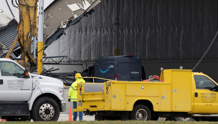 Rescue operations are unfolding outside Amazon's wrecked warehouse.Photos: social media
