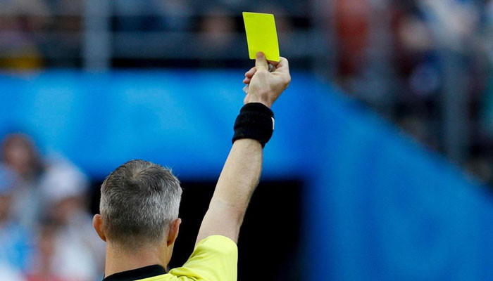 What do yellow and red cards mean in football?