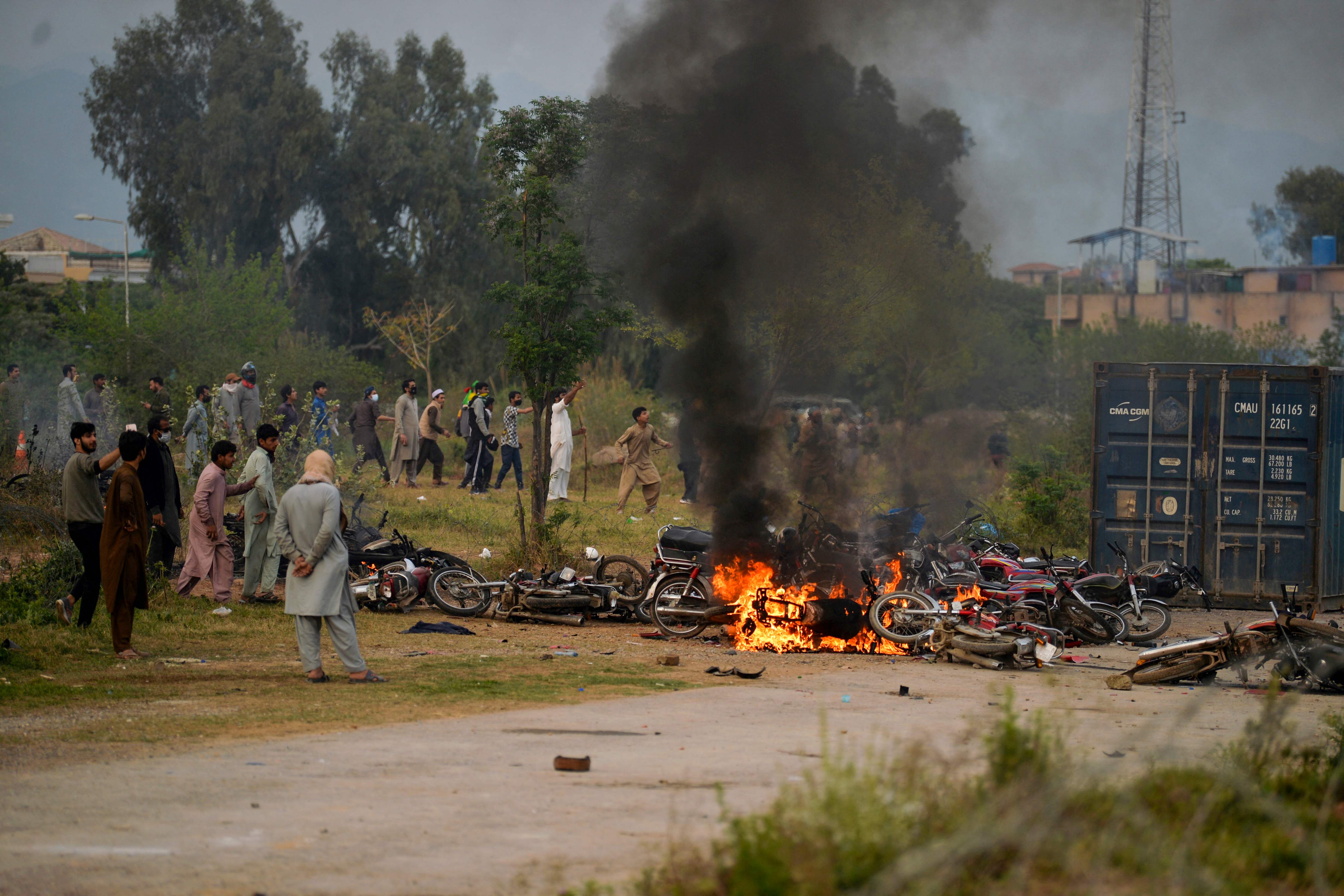 Dozens of motorcycles were also set on fire by Tehreek-e-Insaf workers — Photo: AFP