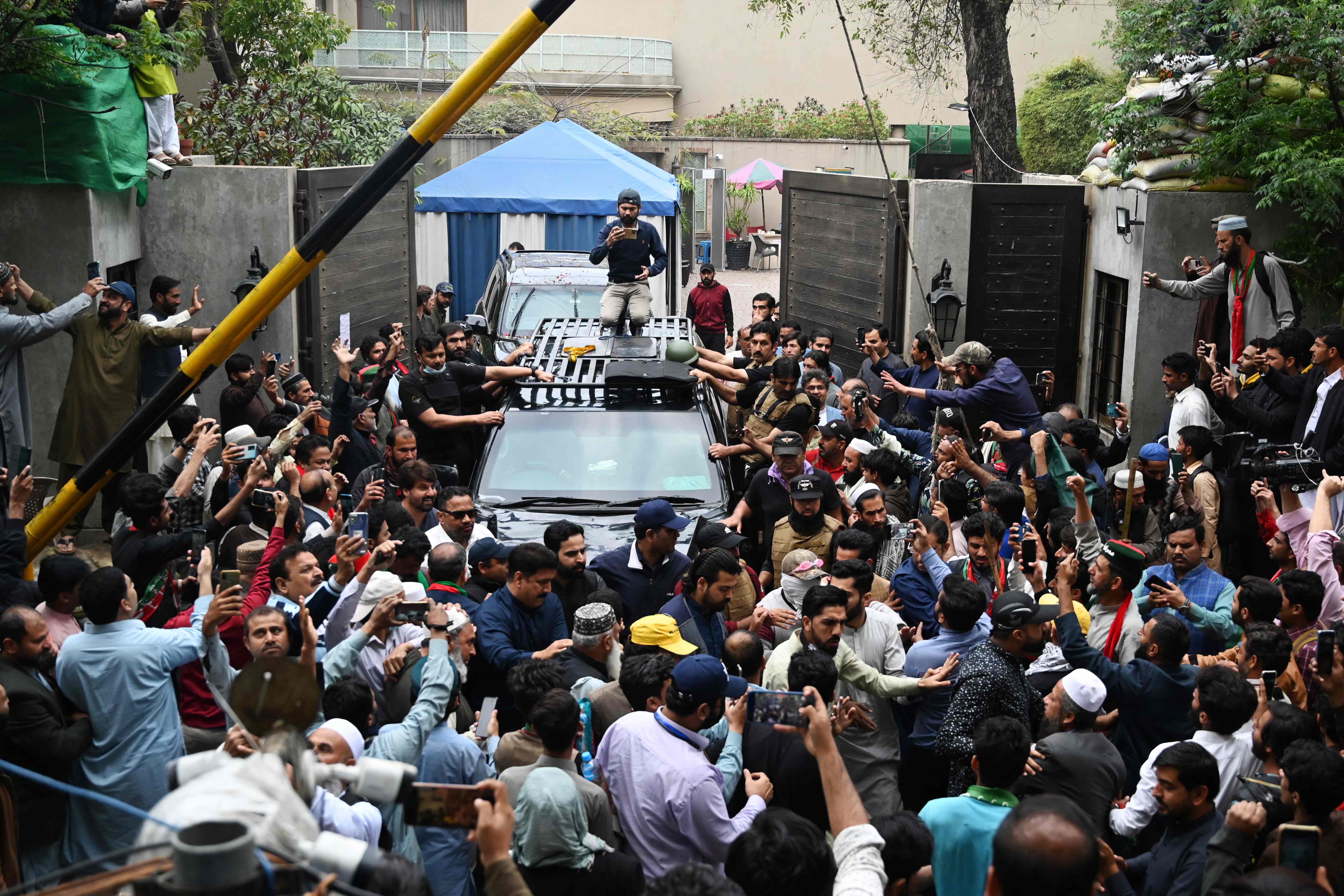 Tehreek-e-Insaf Chairman leaving Islamabad Court Complex from Zaman Park Lahore - Photo: AFP