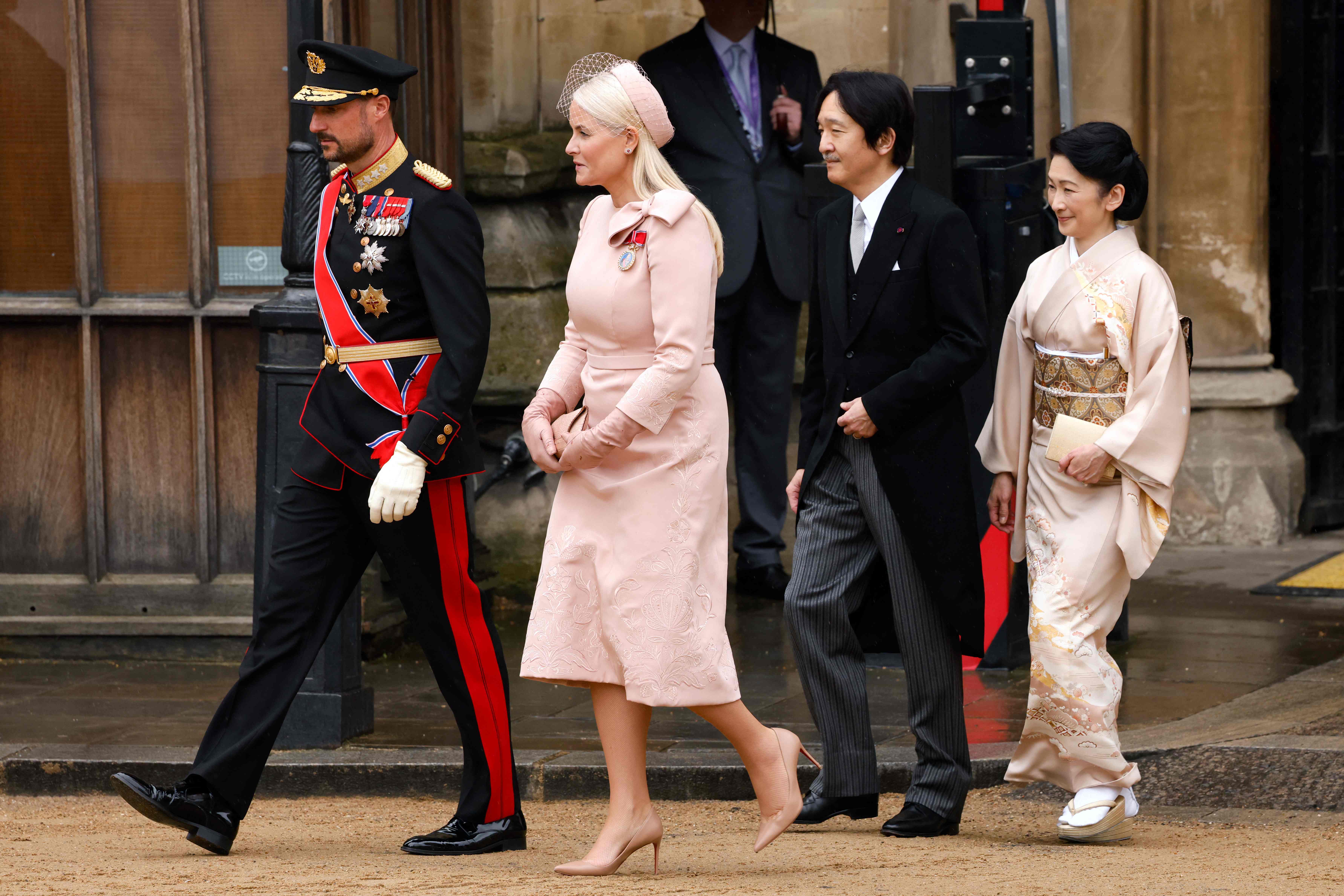 Norway's Crown Prince Haakon (front left) with his wife Mette-Mariet (second from left) while on the right Japan's Prince Fumihito and Princess Keiko attend the ceremony.