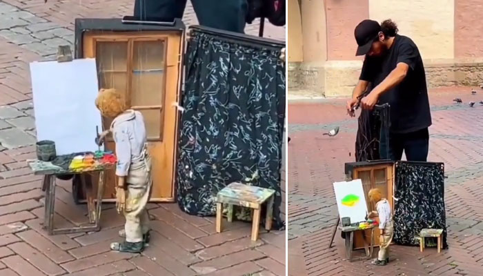 سوشل میڈیا پر ایک ویڈیو وائرل ہورہی ہے جس میں ایک کٹھ پتلی کو سڑک پر پینٹنگ کرتے دیکھا جاسکتا ہے/ فوٹو اسکرین گریب